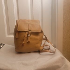Coach F3W 9858 Legacy Tan Leather Drawstring Backpack, the backpack has some lit